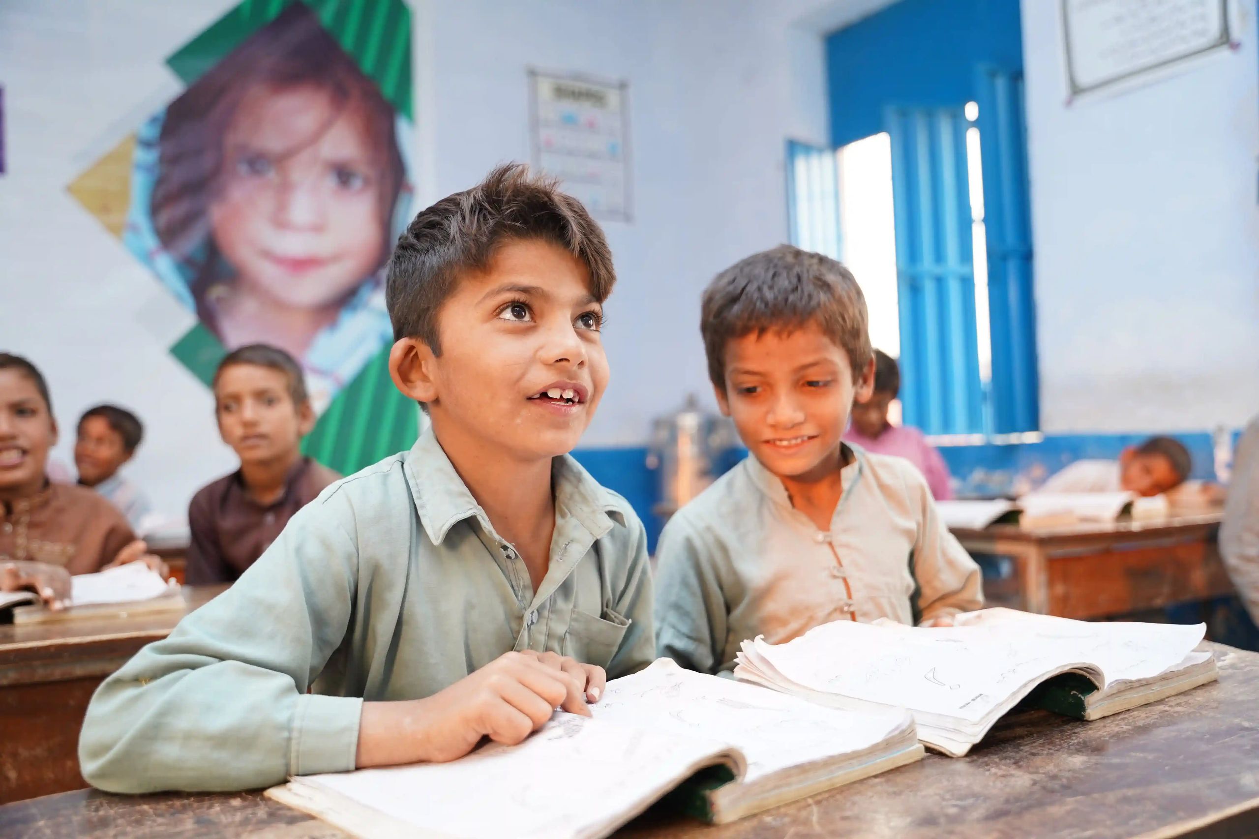 Children receiving educational support through Paigham-e-Pakistan scholarship program